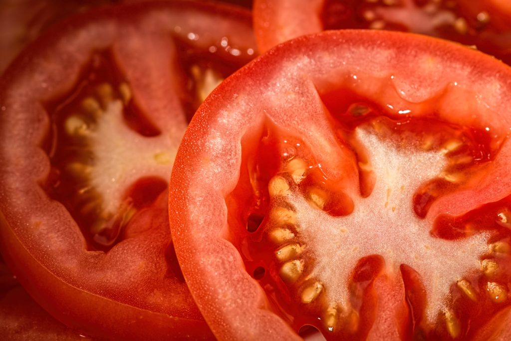close up on sliced red tomatoes